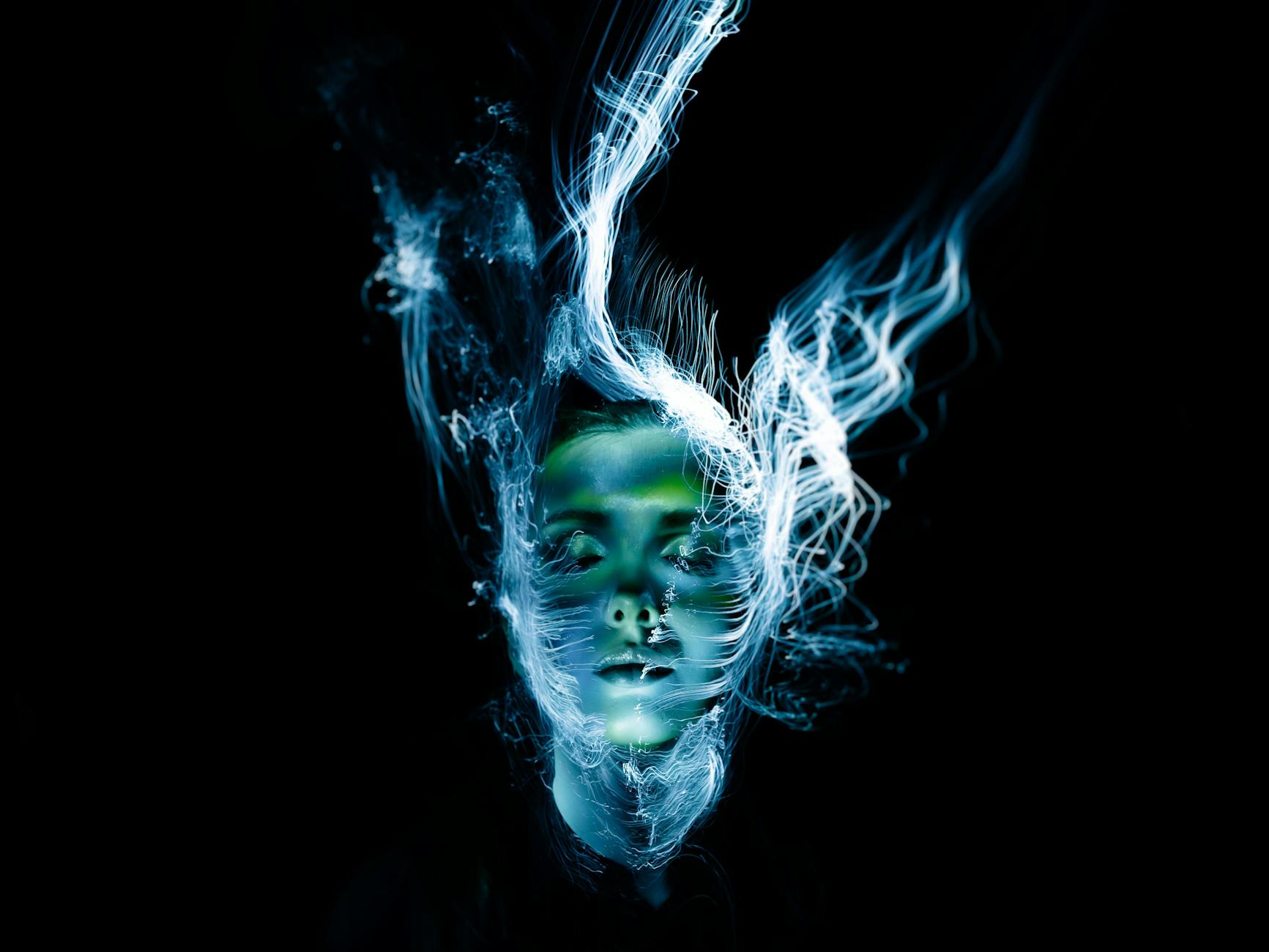 Young woman practicing consistent skincare routine, achieving glowing skin with various beauty products and tools in a well-lit bathroom setting.