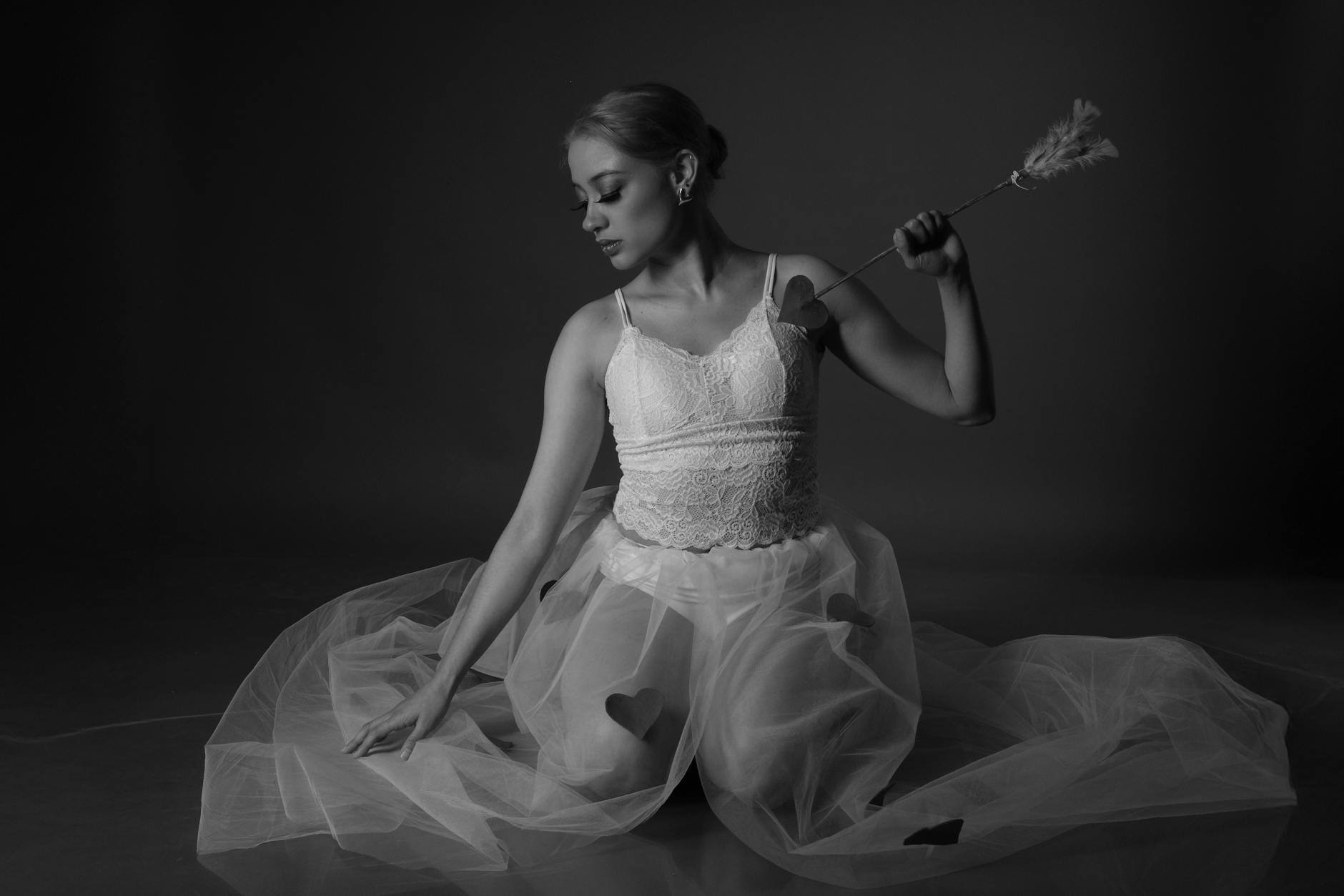 A beautiful woman with glowing skin and radiant smile, surrounded by makeup products in a colorful boho-chic background, promoting beauty transformation.